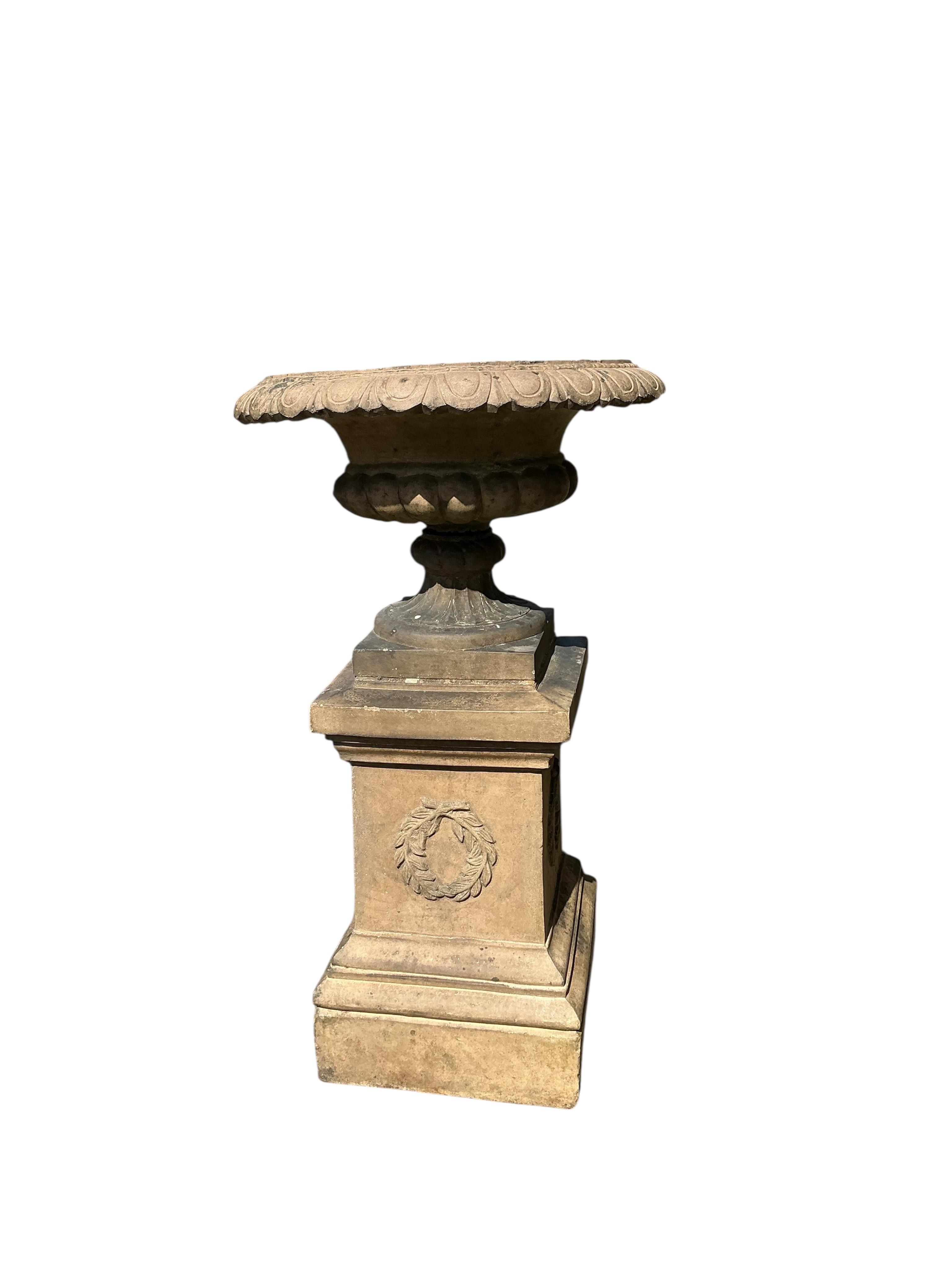 A Victorian Gibbs & Canning, Tamworth earthenware garden campana urn, on square pedestal base, diameter 65cm, height 113cm